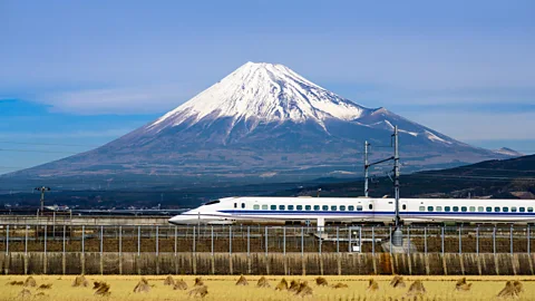 A bullet train in Japan with Mt Fuji in the background (Credit: Alamy)