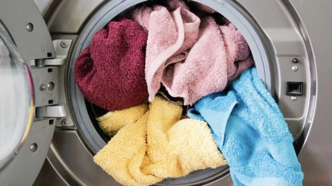 A dirty towel hanging in a bathroom (Credit: Getty Images)