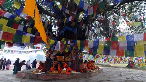 Prakash Mathema/AFP/Getty Nepalese Buddhists pray beside Lumbini's Maya Devi Temple (Credit: Prakash Mathema/AFP/Getty)