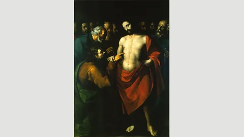 Wikimedia In López de Arteaga’s undated work The Incredulity of Saint Thomas, the red smock worn by Christ, denoting his holiness, pops off the canvas (Credit: Wikimedia)