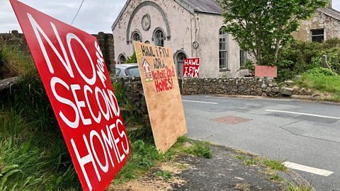 Sign outside Capel Bethania in Pistyll saying 'no more second homes'.