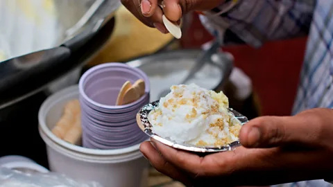 IndiaPictures/Getty Images Close-up Of Vendor Preparing Daulat Ki Chaat (Credit: IndiaPictures/Getty Images)