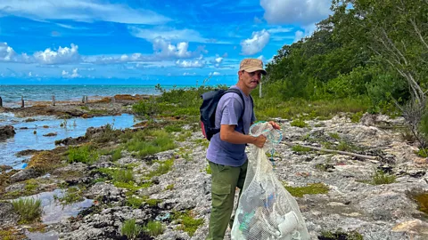 Claire Boobbyer Nene's mission is to help protect the coral reef and wildlife of his home village, Cocodrilo (Credit: Claire Boobbyer)