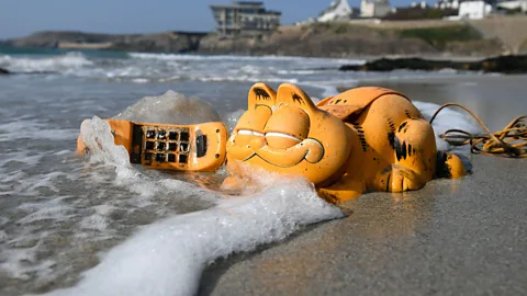 Getty Images Garfield phones turned up on French beaches for years before the explanation was found (Credit: Getty Images)