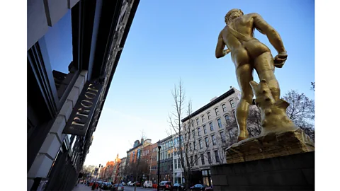 Alamy A 10m-tall gold replica of Michelangelo's David was created by Turkish-American artist Serkan Ozkaya for the 2005 Istanbul Biennale (Credit: Alamy)