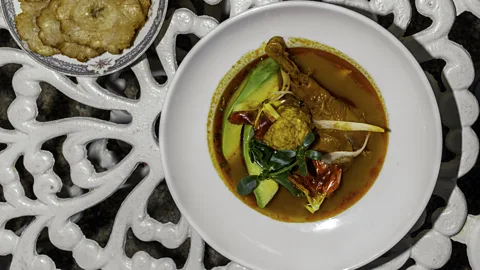 Javier Piñero Caldo de gallina is a rich hen soup with herbs and garlicky plantain balls (Credit: Javier Piñero)