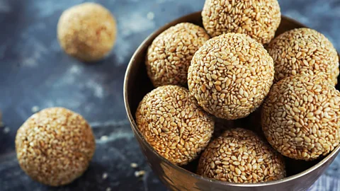 vm2002/Alamy Tilgul ladoos are round sweets made from sesame seeds and jaggery (Credit: vm2002/Alamy)