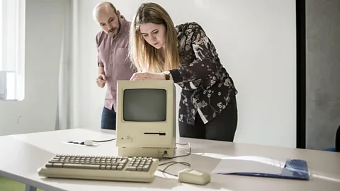 Alamy Museum workers at the Ukrainian Apple Museum in Kiev inspect a Macintosh 128K signed by Steve Wosniak (Credit: Alamy)