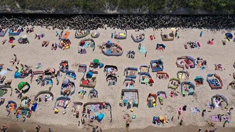 Getty Images It's common to see lots of windbreaks on Polish beaches – a tradition with roots in the post-war Polish People's Republic (Credit: Getty Images)