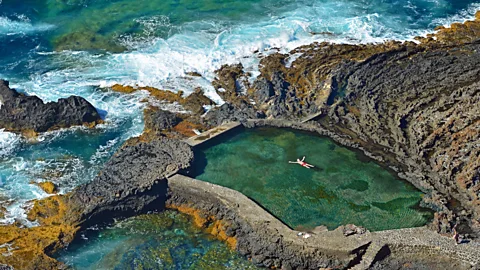 Getty Images The island is home to natural volcanic rock pools protected from the powerful ocean currents (Credit: Getty Images)