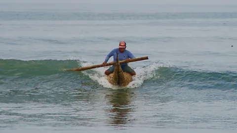 Heather Jasper Fishermen sit on caballitos and surf the waves back to the beach with their catch (Credit: Heather Jasper)