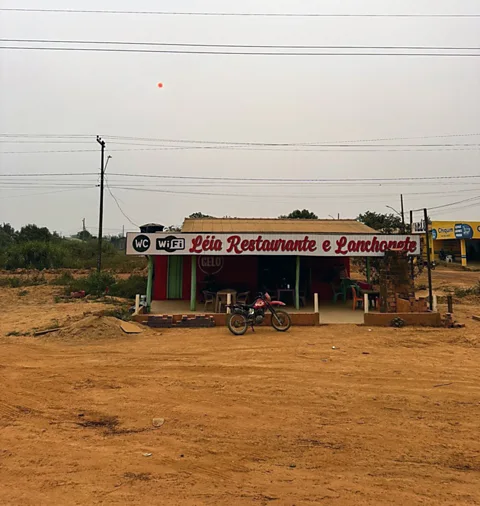 Dougie Loynes Léia opened her café in Realidade in 2019 and is still waiting for the road to be paved (Credit: Dougie Loynes)