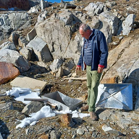 Sophie Hardach Paul Grüner and the spring he found in the mountains, which supplies his refuge (Credit: Sophie Hardach)