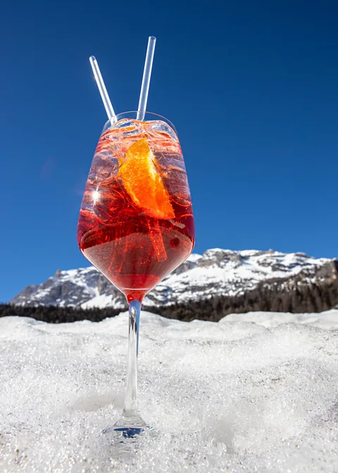 Getty Images Après-ski drinks and socialising is a beloved tradition in the Dolomites (Credit: Getty Images)