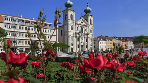 Getty Images Church of Saint Ignatius with red roses in the foreground, Gorizia (Credit: Getty Images)