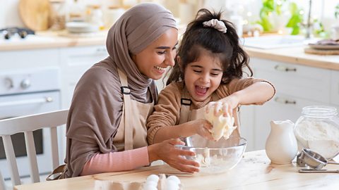 Mother and daughter baking together 