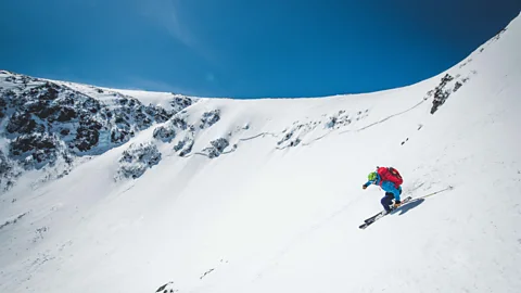 Alamy Man skiing down steep terrain in Tuckerman Ravine, New Hampshire (Credit: Alamy)