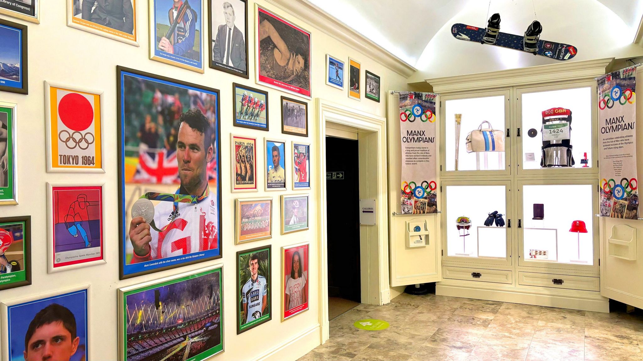 An exhibition of photographs and items relating to Manx Olympians, including picturs of Sir Mark Cavendish and Peter Kennaugh, a snowboard, a bag and the Olympic baton