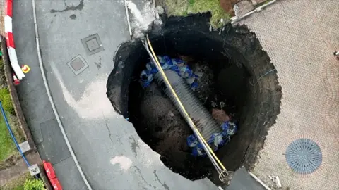 sinkhole being filled in Merthyr Tydfil 