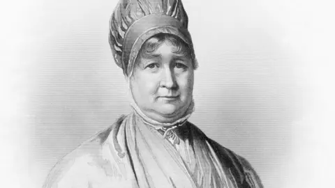 A black-and-white line portrait of Elizabeth Fry. She is wearing a turban-style hat and her hair is curling on her forehead. The high collar of her shirt comes up around her neck and her dress is crossed over her chest, with a glimpse of a lighter-coloured shirt beneath