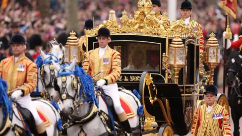 Reuters The King and Queen travelled in the Gold State Coach, led by horses dressed with magnificent blue plumes
