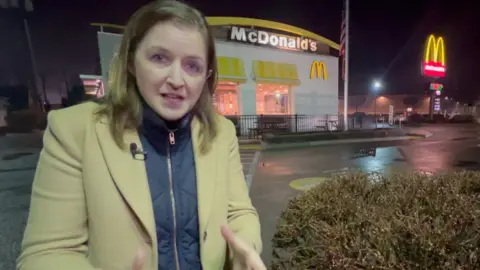 BBC correspondent outside McDonald's 