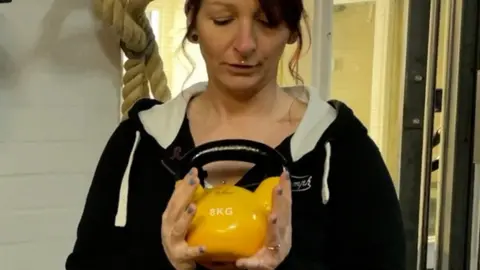 Steph holding kettle bell