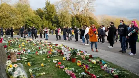 Reuters People gather outside Windsor Castle after Prince Philip's death