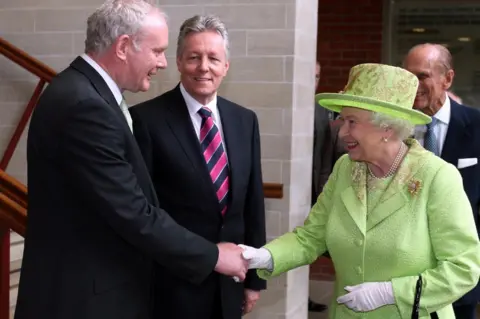 PA Martin McGuinness shakes hands with the Queen