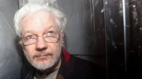Reuters Julian Assange leaving Westminster Magistrates' Court in January 2020