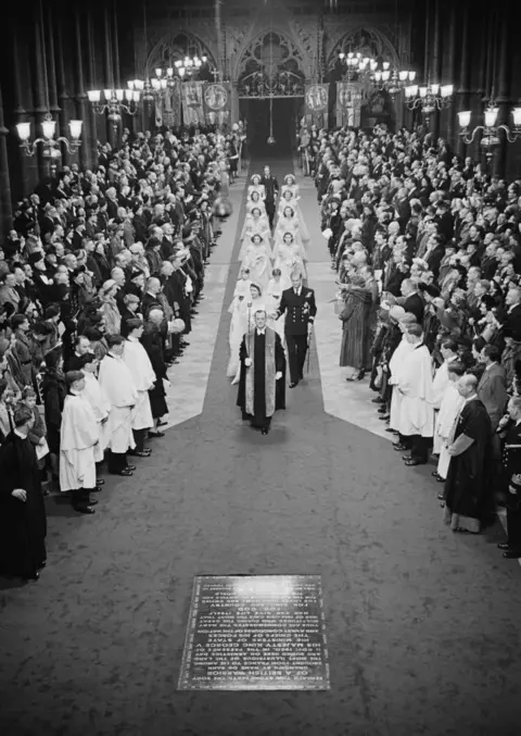 Bert Hardy / Getty Images Princess Elizabeth (later Queen Elizabeth II) and Philip Mountbatten (later Prince Philip) make their way down the aisle of Westminster Abbey, London, on their wedding day, 20th November 1947.