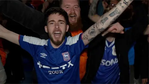 Ipswich fans celebrate.