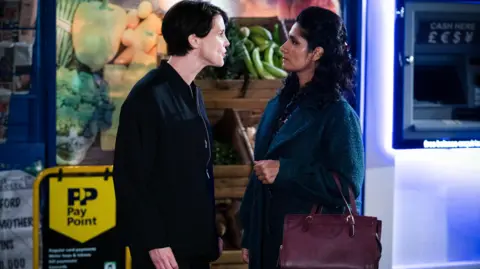 Heather Peace and Balvinder Sopal appearing in a scene together in Eastenders, as their characters Eve Unwin and Suki Kaur Panesar.