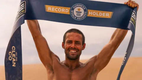 Stone Visuals UK Spencer Matthews holding a Guinness World Records banner