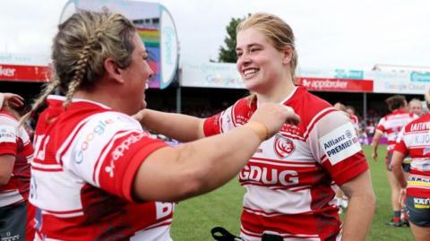 Bethan Lewis celebrates winning the Premiership title with team mates