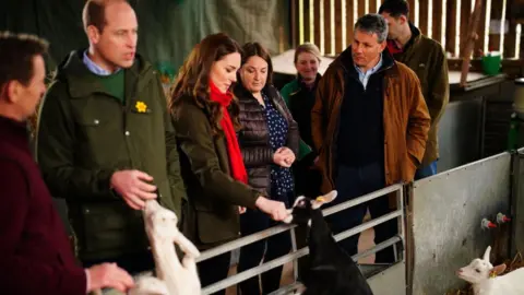 Getty Images Prince William and Catherine meet some goats as they visit Pant Farm near Abergavenny