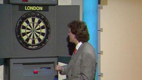 Bobby George with an electronic darts machine