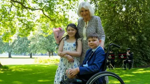 Tony Hudgell with Queen Camilla and Lyla O'Donovan