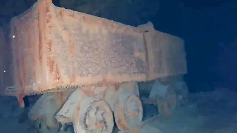 Mine cart under water