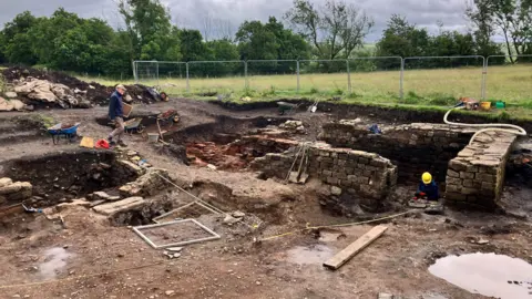 BBC The excavation site at the Roman fort of Birdoswald in Brampton, Cumbria