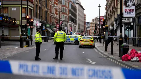 The scene on Shaftesbury Avenue in central London after four people were injured, one seriously, by a car which was driven onto a pavement in central London in the early hours of Christmas Day.