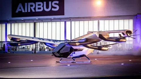 Airbus The CityAirbus sits outside an Airbus hanger