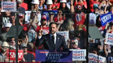 Getty Images JD Vance speaks in front of a crowd at a rally in Butler, Pennsylvania in October 2024