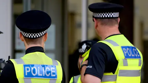 Police officers with hi-vis jackets on 