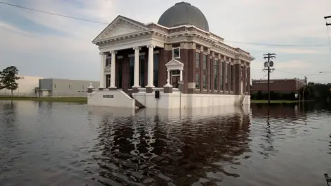 Getty Images Floodwater surrounds a Baptist church in Texas