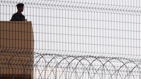 Jail guard stands at Changi Prison in Singapore