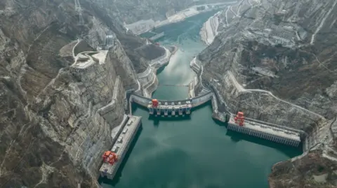 Getty Images An aerial photo shows Wudongde Hydropower Station on the Jinsha river, the world's seventh largest hydropower station, on the channel of the Jinsha river in Liangshan prefecture, Sichuan Province, China, December 31, 2022. 