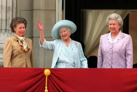 Getty Images Princess Margaret (L) and Queen Elizabeth (R) stand next to the Queen Mother as she waves to admirers on the occasion of her 100th birthday celebration 4 August, 2000 in London.