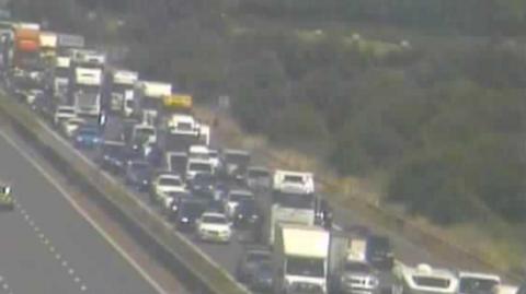 A queue of vehicles in a three-lane traffic jam on the M5