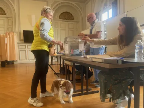 BBC Claudine and Zapie at a polling station in Meaux to the east of Paris 